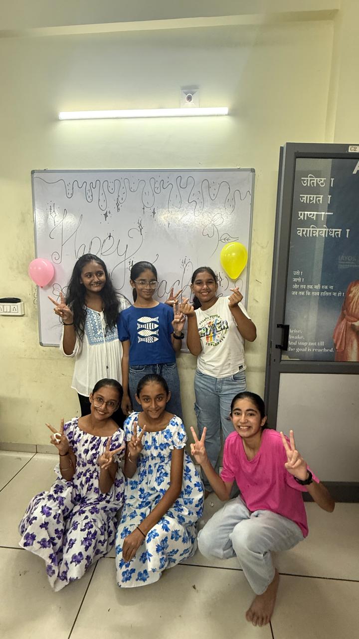 Students celebrating together at Awaken Coaching Centre